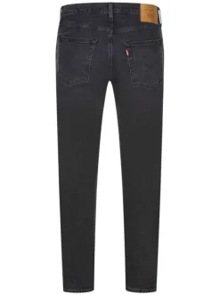 Jean 512 brut uni avec une coupe slim et un patch d'authentification