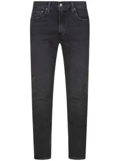 Jean 512 brut uni avec une coupe slim et un patch d'authentification