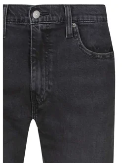 Jean 512 brut uni avec une coupe slim et un patch d'authentification