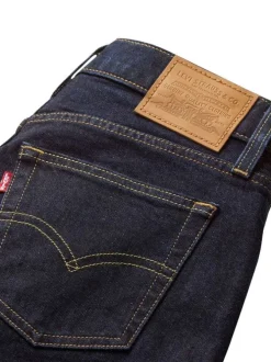Jean brut uni en coton avec une coupe bootcut et multiples poches plaquées