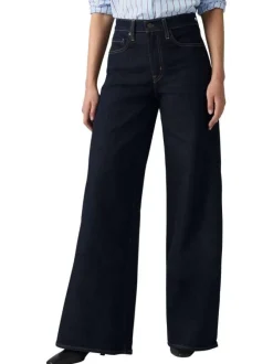 Jean brut uni en coton avec une coupe bootcut et multiples poches plaquées