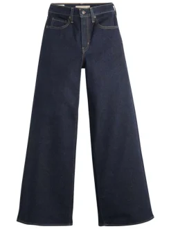 Jean brut uni en coton avec une coupe bootcut et multiples poches plaquées