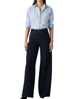 Jean brut uni en coton avec une coupe bootcut et multiples poches plaquées