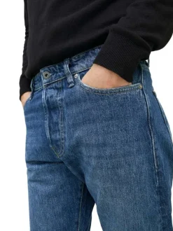 Jean Chris en coton mélangé indigo avec une coupe regular et patch à l'arrière