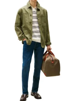 Jean Denton en coton indigo coupe droite avec un patch de la marque à l'arrière