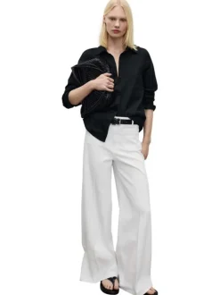 Jean en coton blanc uni à coupe large avec des poches plaquées à l'avant