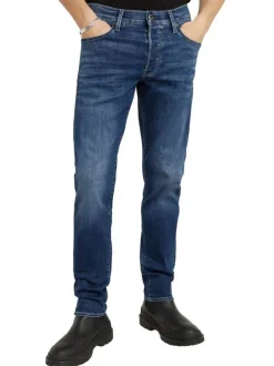 Jean en coton bleu avec des passants pour ceinture et une coupe slim