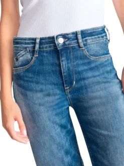 Jean en coton bleu coupe wide leg pourvu d'une fermeture par zip et bouton