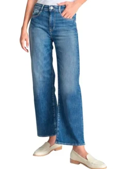 Jean en coton bleu coupe wide leg pourvu d'une fermeture par zip et bouton