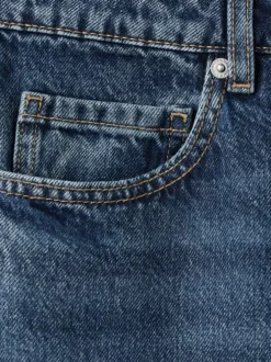 Jean en coton bleu indigo délavé avec une coupe bootcut et 5 poches