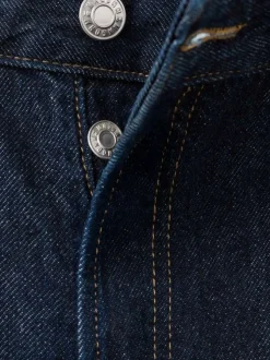 Jean en coton bleu indigo uni avec une coupe bootcut et 5 poches