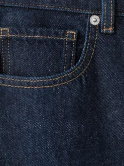 Jean en coton bleu indigo uni avec une coupe bootcut et 5 poches