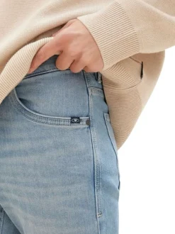 Jean en coton bleu stone délavé aux cuisses avec une coupe slim fit