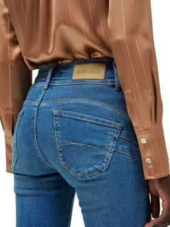 Jean en coton bleu stone uni à coupe slim fermé par deux boutons