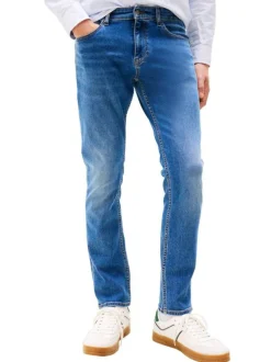 Jean en coton bleu uni avec une coupe slim à zip et à bouton