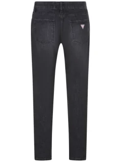 Jean en coton gris uni avec une coupe slim et un patch de la marque à la taille