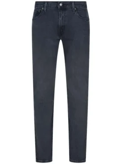 Jean 511 en coton indigo délavé style 5 poches avec une coupe slim