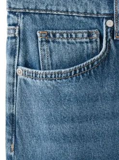 Jean en coton indigo uni avec une coupe droite et des poches plaquées à l'avant