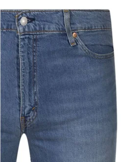 Jean en coton indigo uni avec une coupe slim et une fermeture par zip et bouton