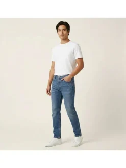 Jean en coton indigo uni avec une coupe slim et une fermeture par zip et bouton