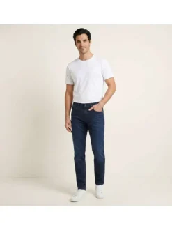 Jean en coton indigo uni avec une coupe slim à zip et bouton