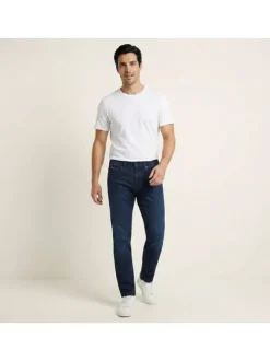 Jean en coton indigo uni avec une coupe slim à zip et bouton