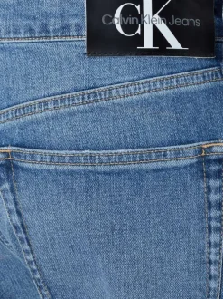 Jean en coton mélangé bleu délavé avec une coupe slim et à 5 poches
