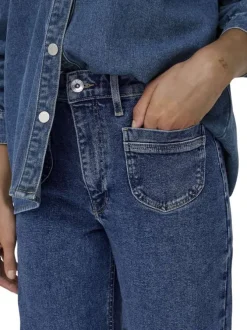Jean en coton mélangé bleu indigo uni à coupe bootcut avec des poches plaquées