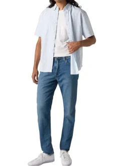 Jean 512 en coton mélangé bleu uni avec une coupe slim et des passants