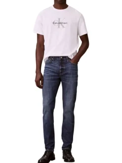 Jean en coton mélangé indigo uni avec une coupe slim à zip et bouton