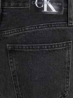 Jean en coton mélangé noir délavé avec une coupe mom et une taille haute