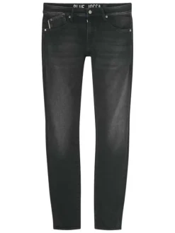Jean en coton mélangé noir uni avec une coupe slim et un zip de fermeture