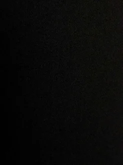 Jean en coton mélangé noir uni à coupe bootcut avec boutons chromés