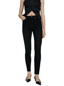 Jean en coton noir uni taille haute à coupe skinny avec rivets cuivrés