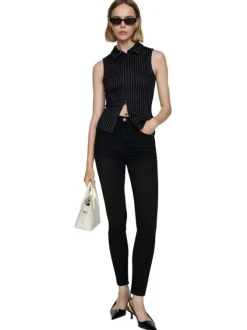 Jean en coton noir uni taille haute à coupe skinny avec rivets cuivrés