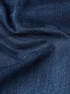 Jean en coton nuit avec une coupe slim et des passants pour ceinture