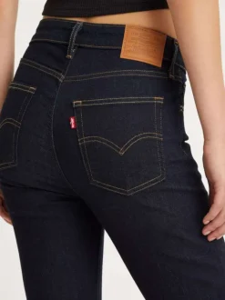 Jean 721™ High Rise en coton mélangé brut uni avec une coupe skinny