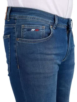 Jean indigo délavé avec une coupe ajustée et des passants pour la ceinture
