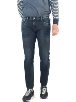 Jean 700/11 Jogg en coton indigo uni avec une coupe slim et des poches plaquées à l'arrière