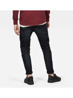 Jean noir avec une coupe slim à poches et des passants pour ceinture