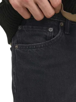 Jean noir uni 5 poches avec une coupe loose et une taille mi-haute