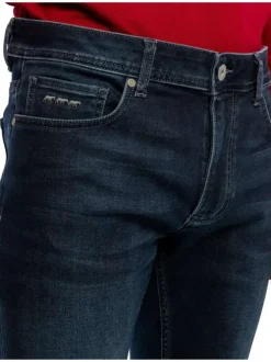 Jean nuit délavé avec une coupe ajustée et des passants pour la ceinture