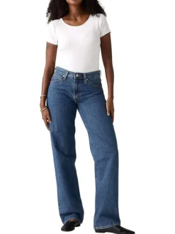 Jean 5 poches en coton bleu délavé avec une coupe large et jacron beige