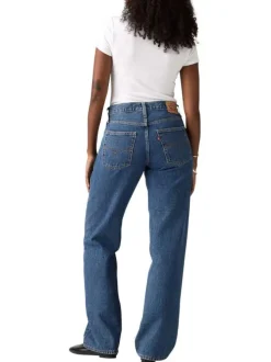 Jean 5 poches en coton bleu délavé avec une coupe large et jacron beige