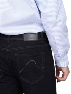Jean 5 poches en coton bleu uni avec une coupe droite et un zip