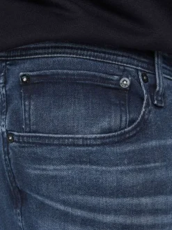Jean slim bleu délavé en coton mélangé avec 5 poches et rivets métalliques