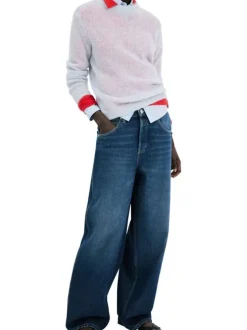Jean taille haute en coton indigo délavé avec une coupe bootcut