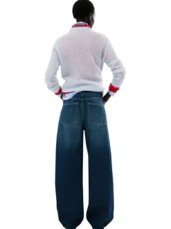 Jean taille haute en coton indigo délavé avec une coupe bootcut