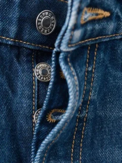 Jean taille haute en coton indigo délavé avec une coupe bootcut