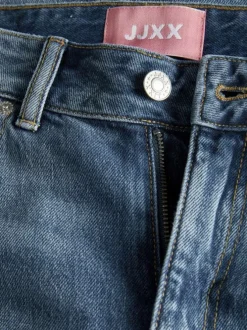 Jean Tokyo en coton bleu légèrement délavé à coupe bootcut et ourlets